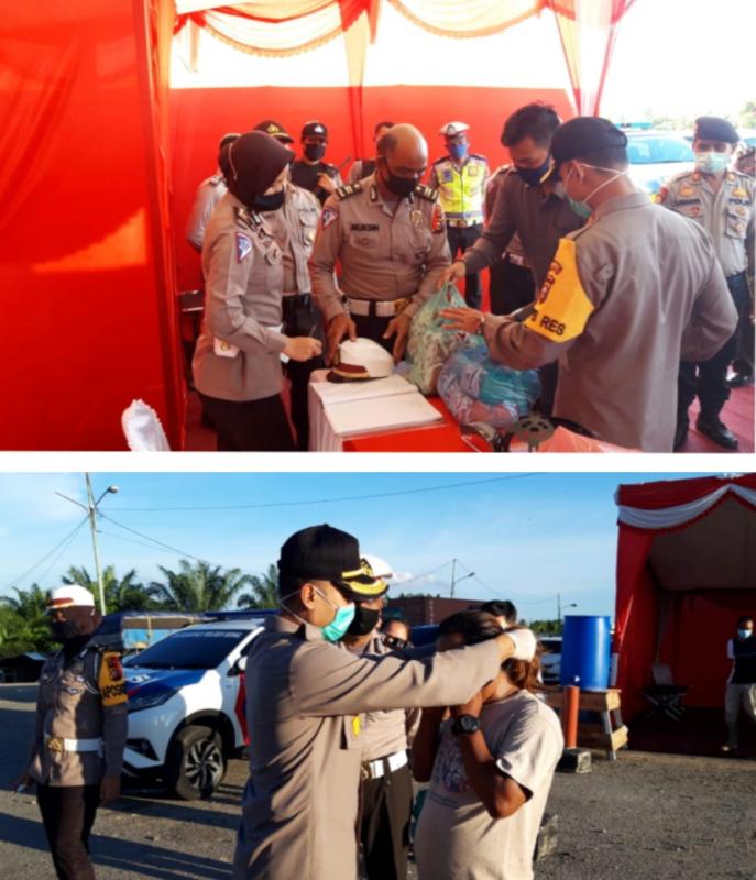 Cek Pospam Rantau Bais. Kapolres Rohil Bagi-Bagi Bingkisan Dan Ratusan Masker Kepengendara