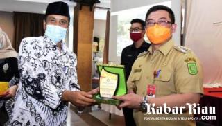 Pj. Bupati Bengkalis Tandatanganan MoU Kerjasama dan dan Sosialisasi Hukum dengan PGRI